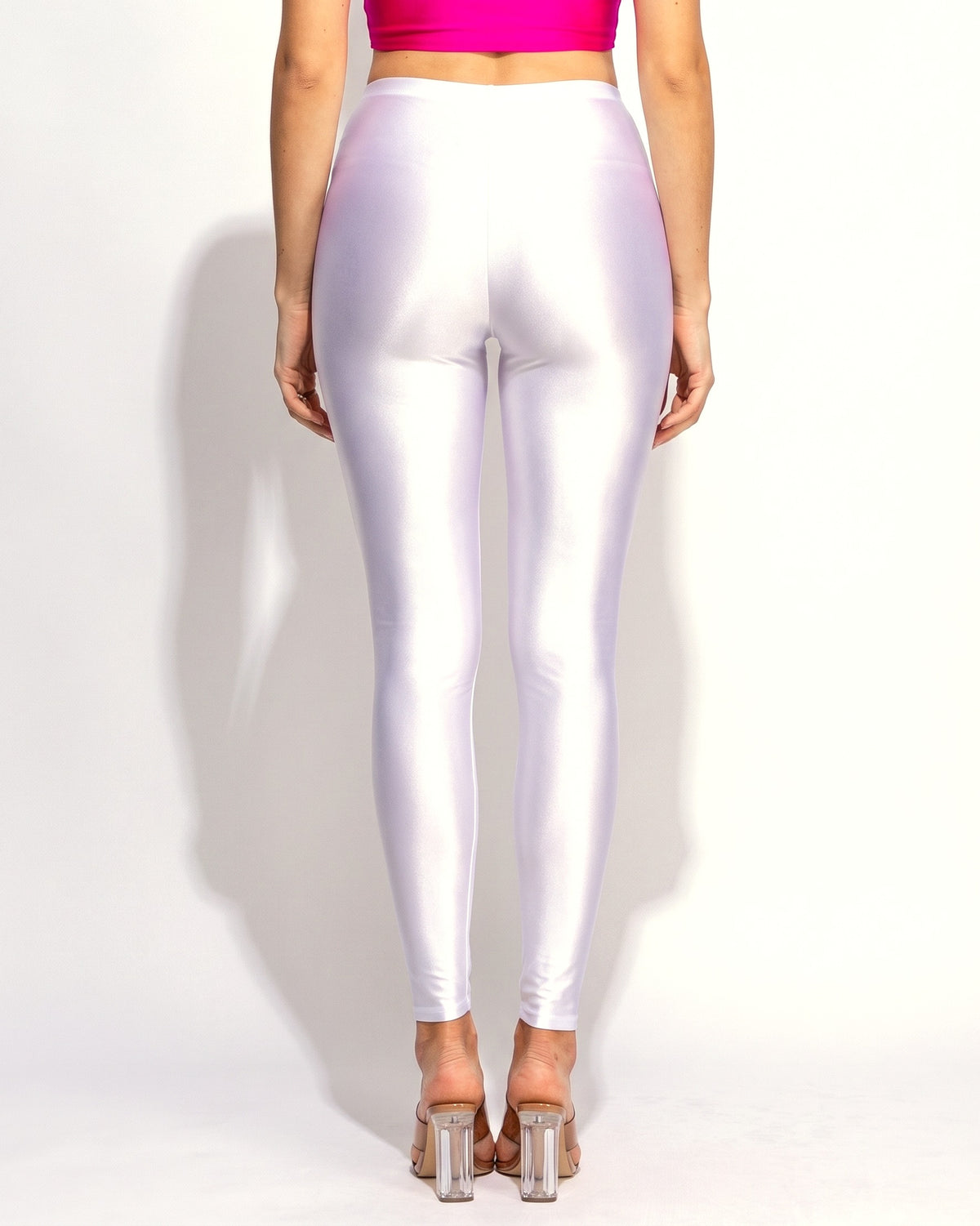 White shiny tricot leggings, back view on model