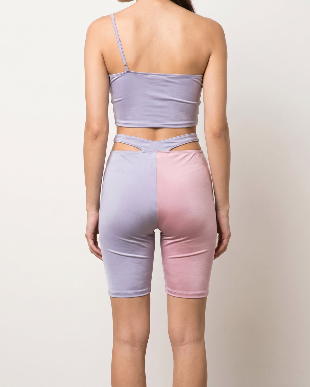 Lavender and blush satin color block biker shorts set, back view on model