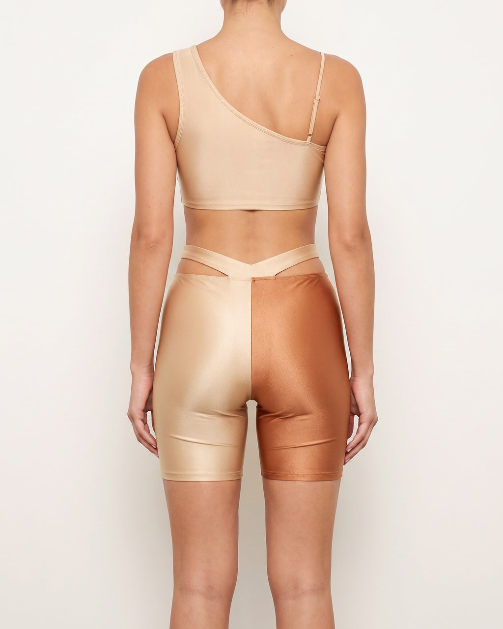 Nude and copper satin color block biker shorts set, back view on model