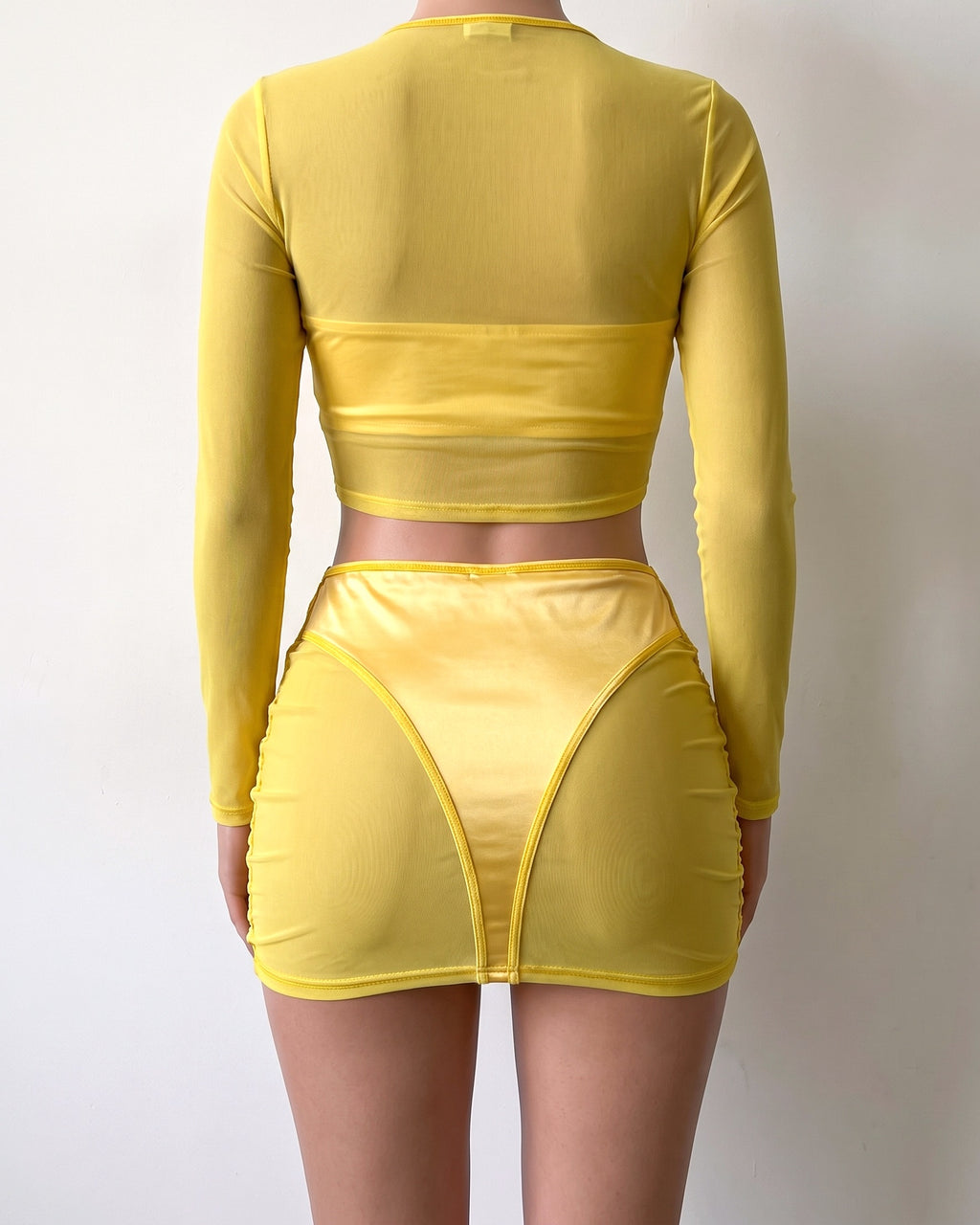 Yellow satin color block mesh skirt set, back view on model