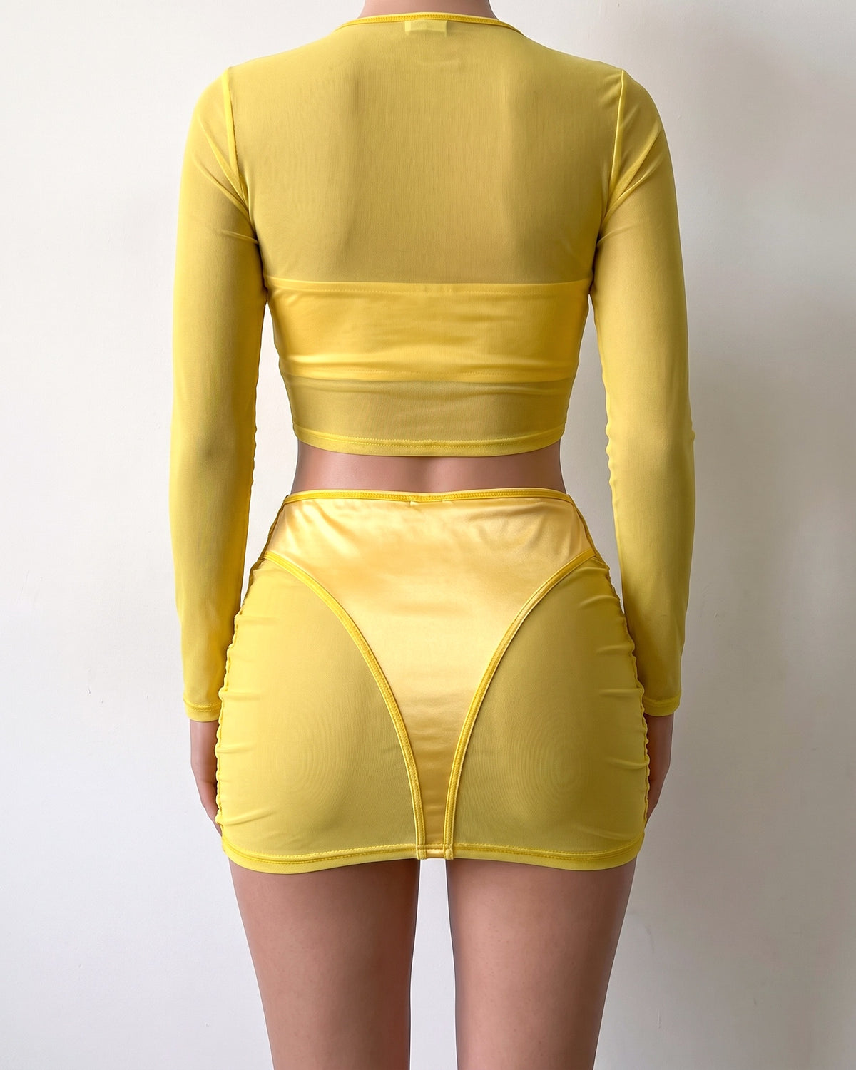 Yellow satin color block mesh skirt set, back view on model