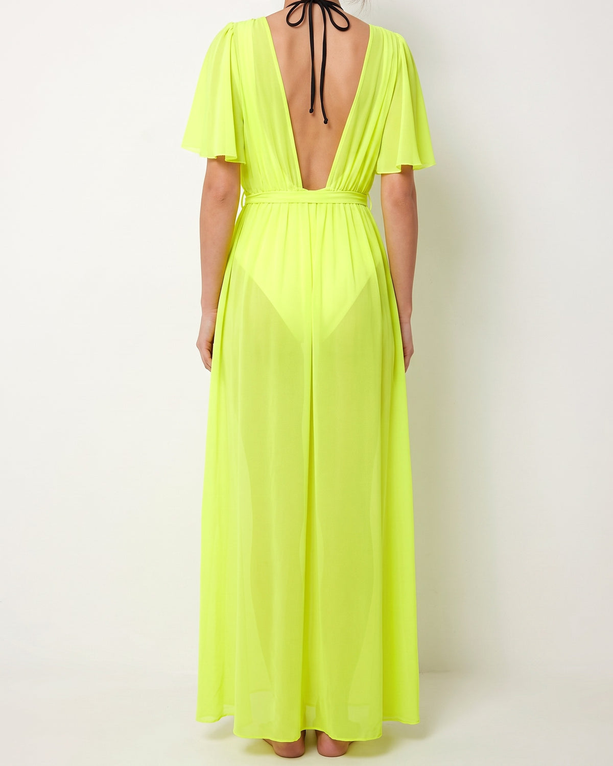 Neon yellow shoulder detailed coverup, back view on model