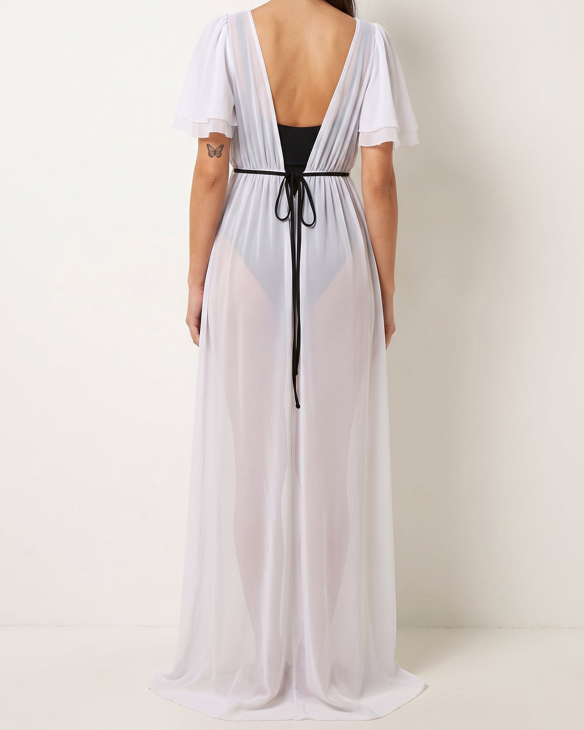 White shoulder detailed coverup, back view on model
