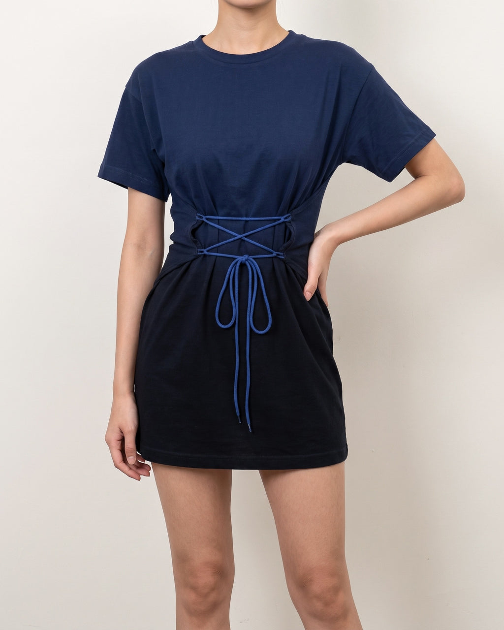 Navy lace up ombre mini dress, alternate front view on model