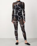 Muvin women's black barbed wire printed mesh jumpsuit, front view on model