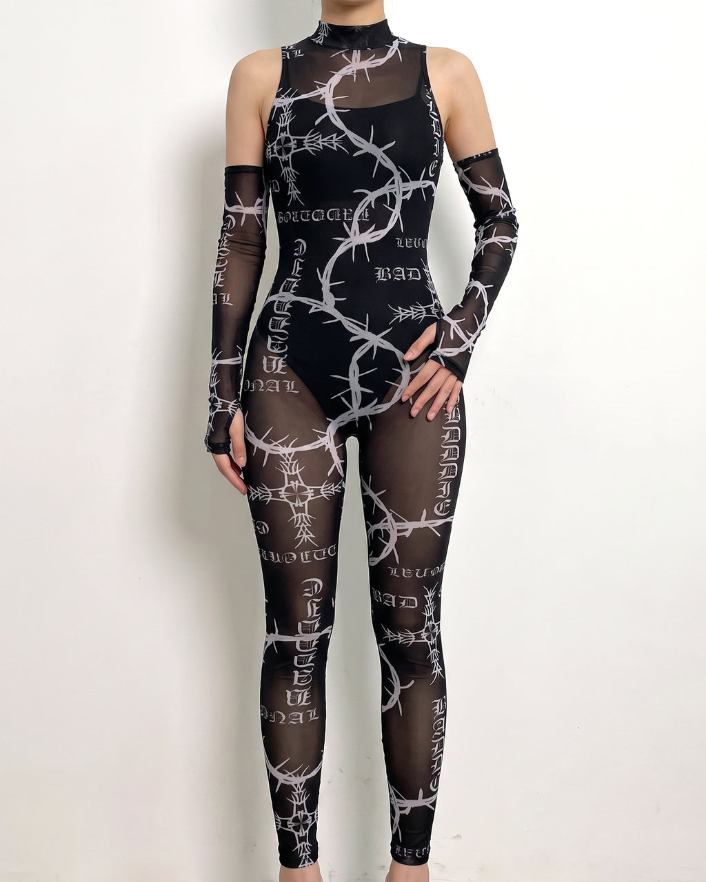 Black barbed wire printed mesh jumpsuit, alternate front view on model