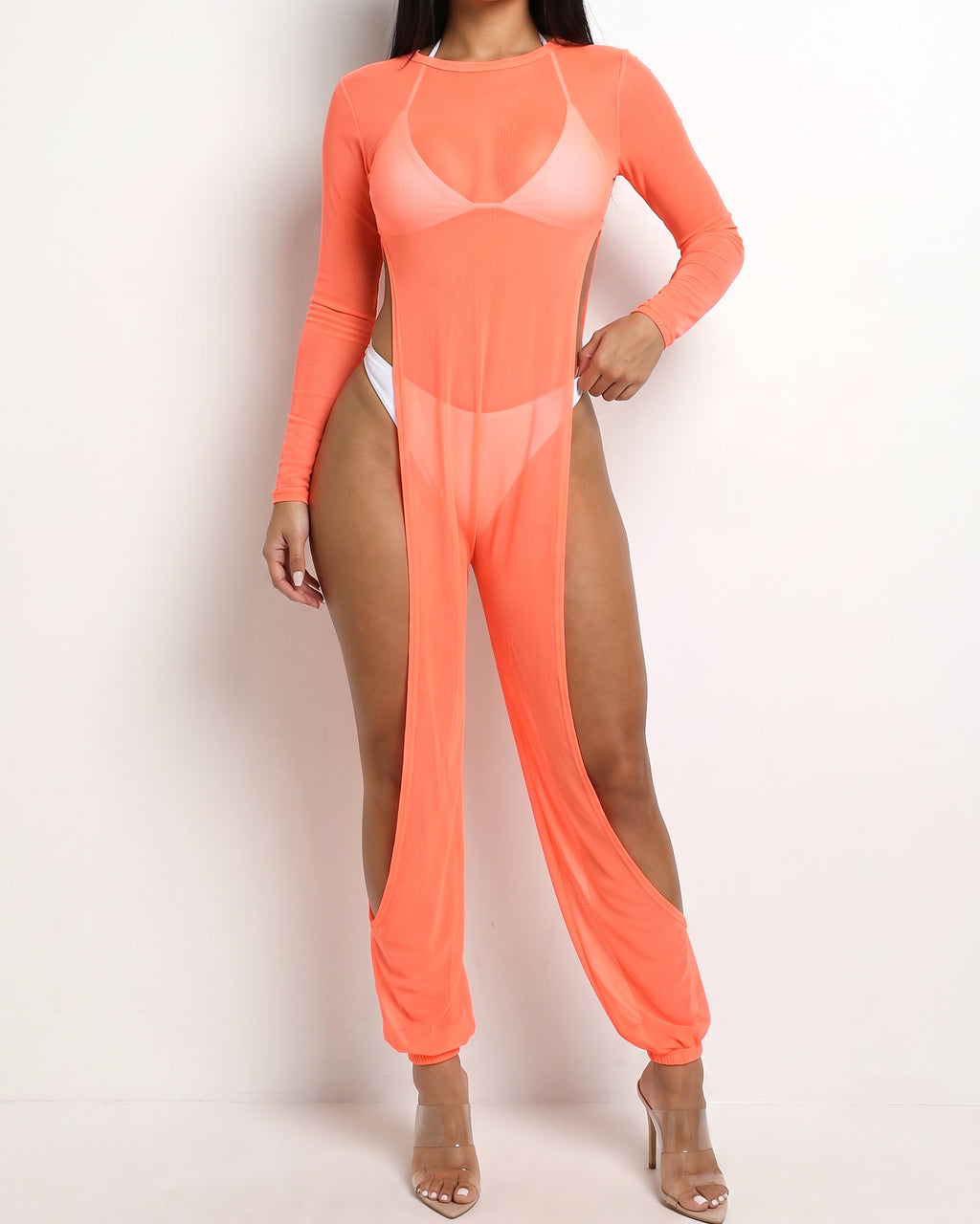 Neon coral mesh coverup jumpsuit, alternate front view on model