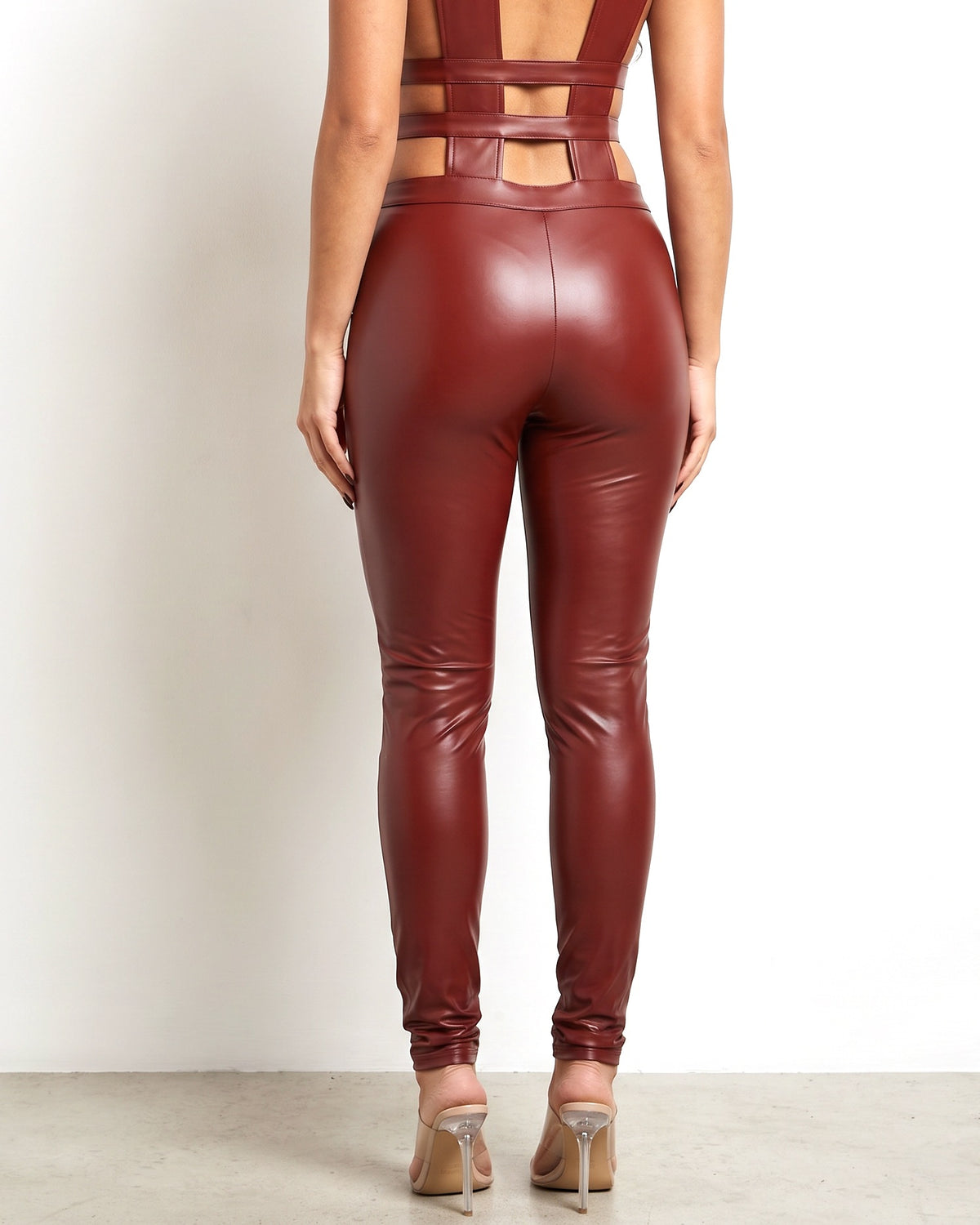 Burgundy matte PU panel jumpsuit, back view on model