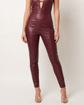 Muvin women's burgundy matte PU panel jumpsuit, front view on model