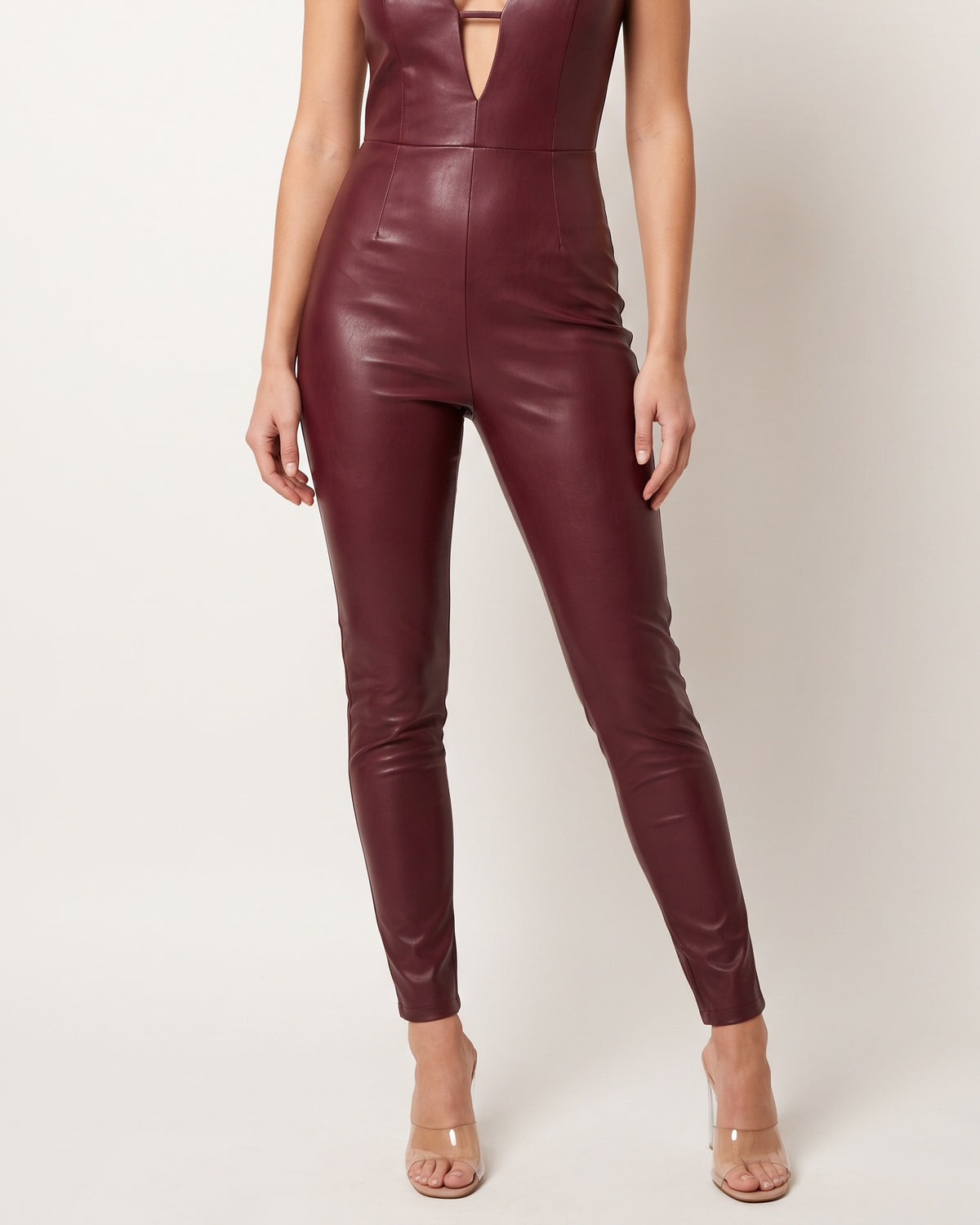 Muvin women's burgundy matte PU panel jumpsuit, front view on model