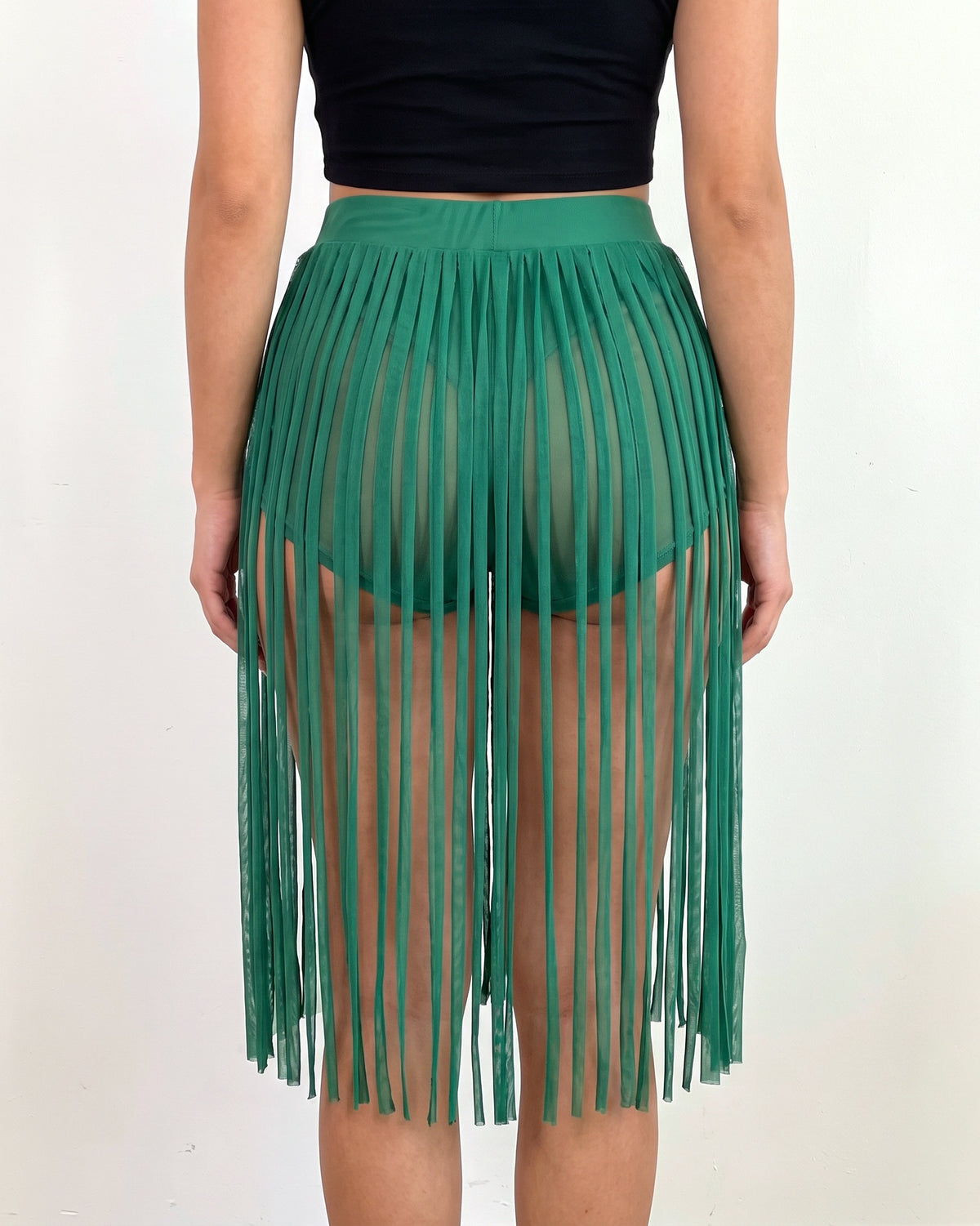 Kelly green fringed mesh shorts, back view on model