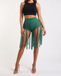 Muvin women's kelly green fringed mesh shorts, front view on model