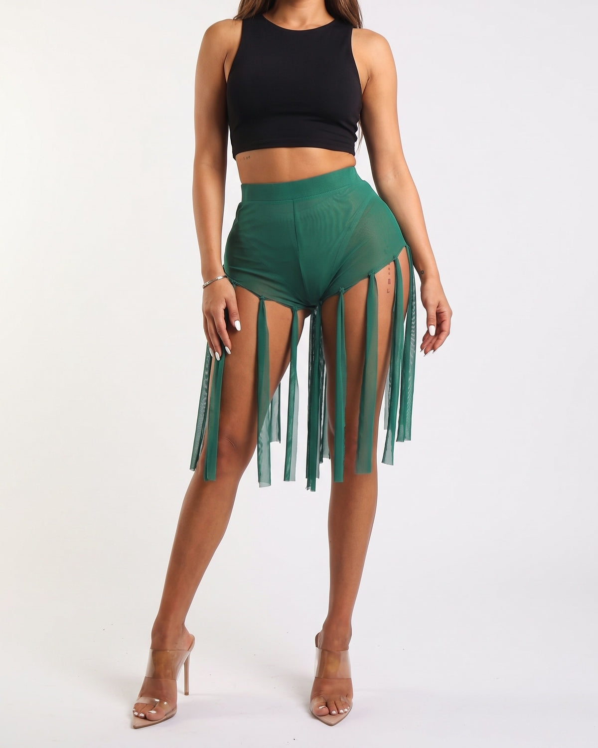 Muvin women's kelly green fringed mesh shorts, front view on model