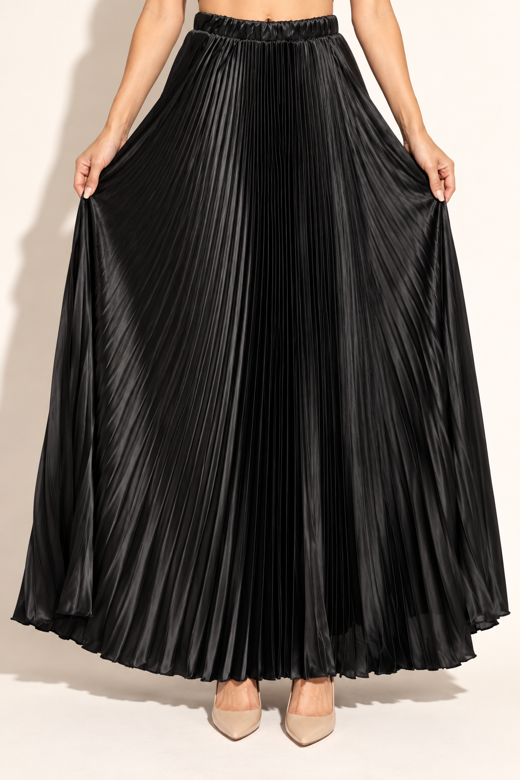 Muvin women's black pleated satin maxi skirt, front view showing full accordion-pleated skirt and elastic waistband