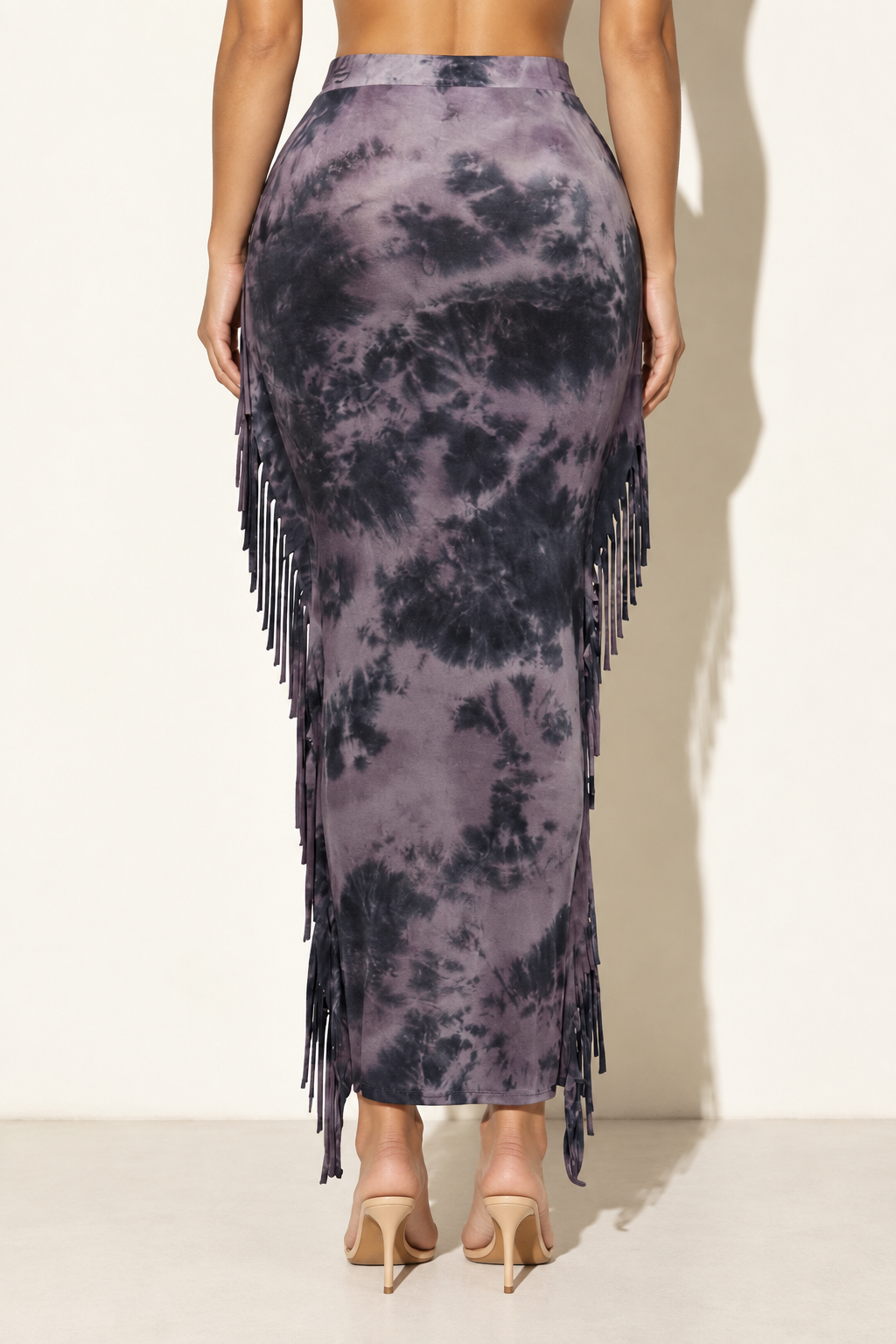 Purple tie-dye fringe maxi skirt, rear view showing plain back and fringe along the side seams