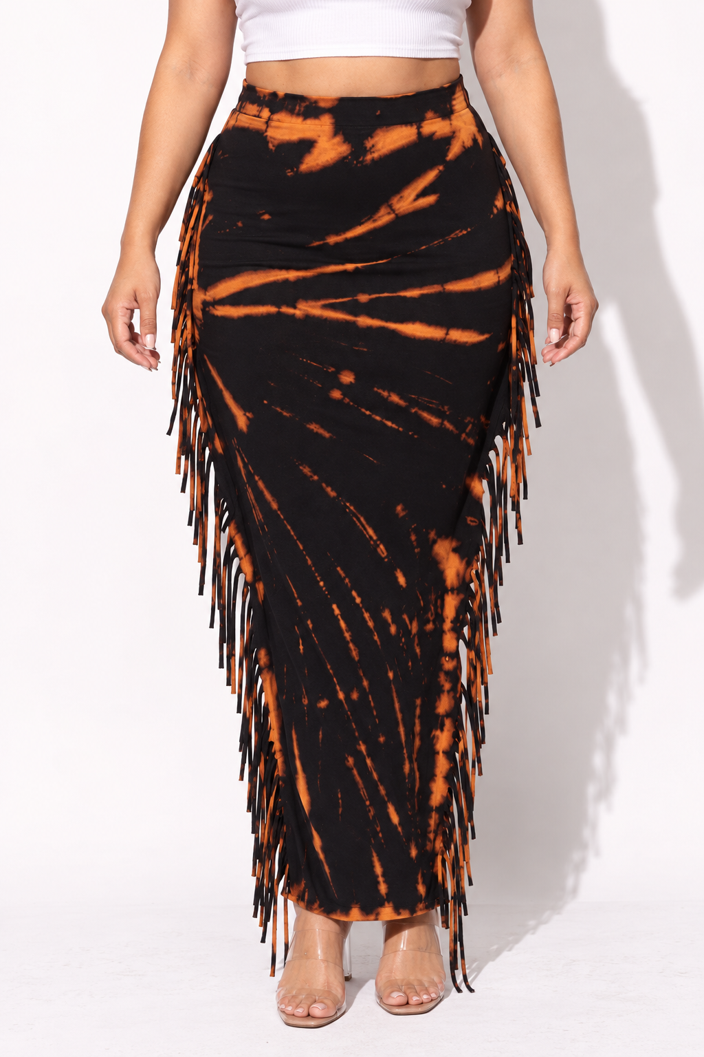 Muvin women's black and rust plus size tie dye fringed maxi skirt, straight front view, showing a flat waistband