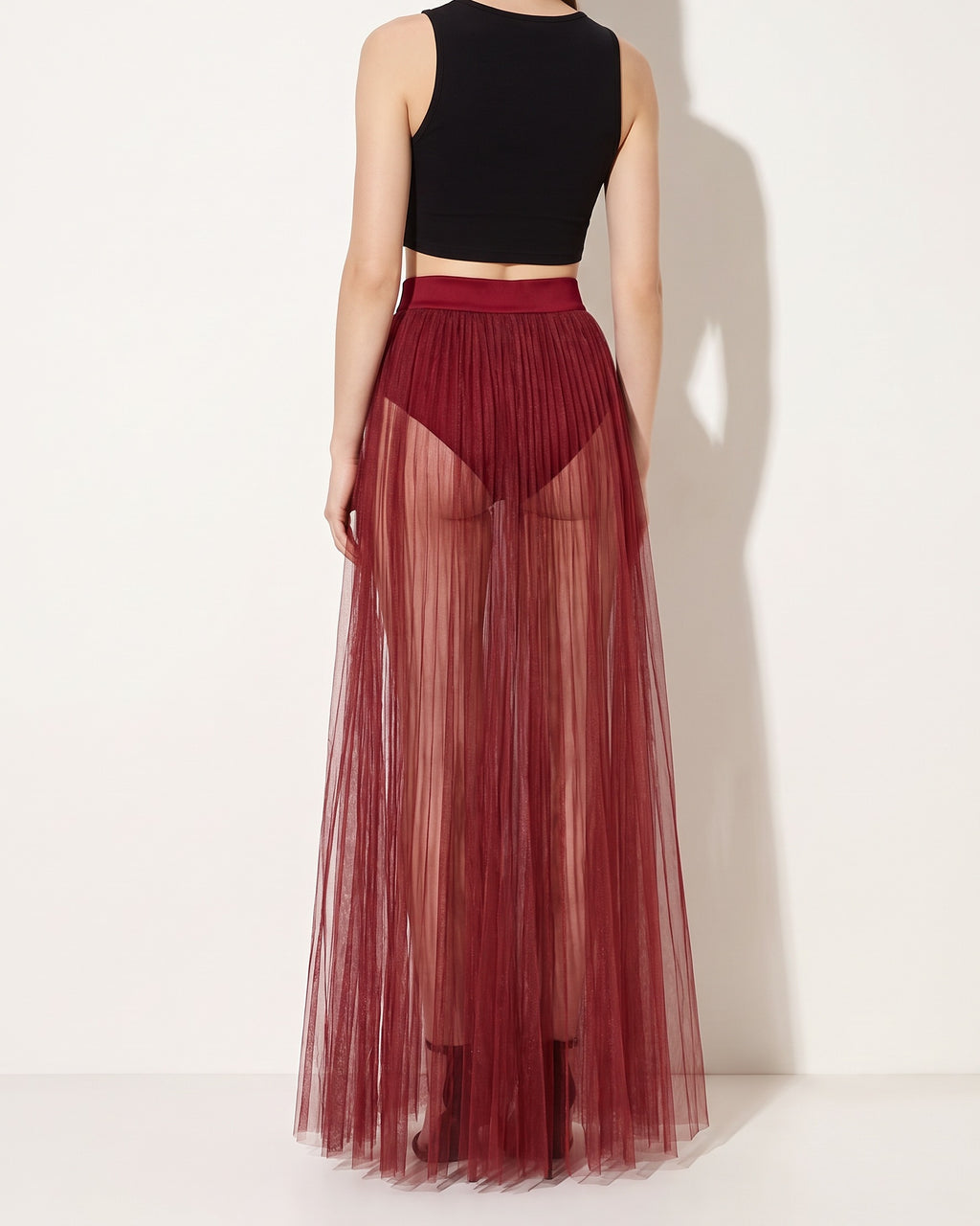 Burgundy pleated mesh maxi skirt, back view on model