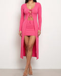 Muvin women's pink tie front top and mini skirt, front view on model