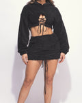 Muvin women's black sherpa lace up detailed mini skirt and hoodie set, front view on model