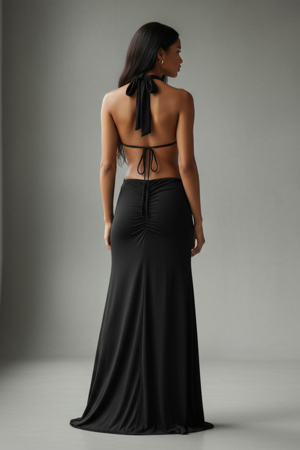 Black cutout open back halter maxi dress, alternate front view on model