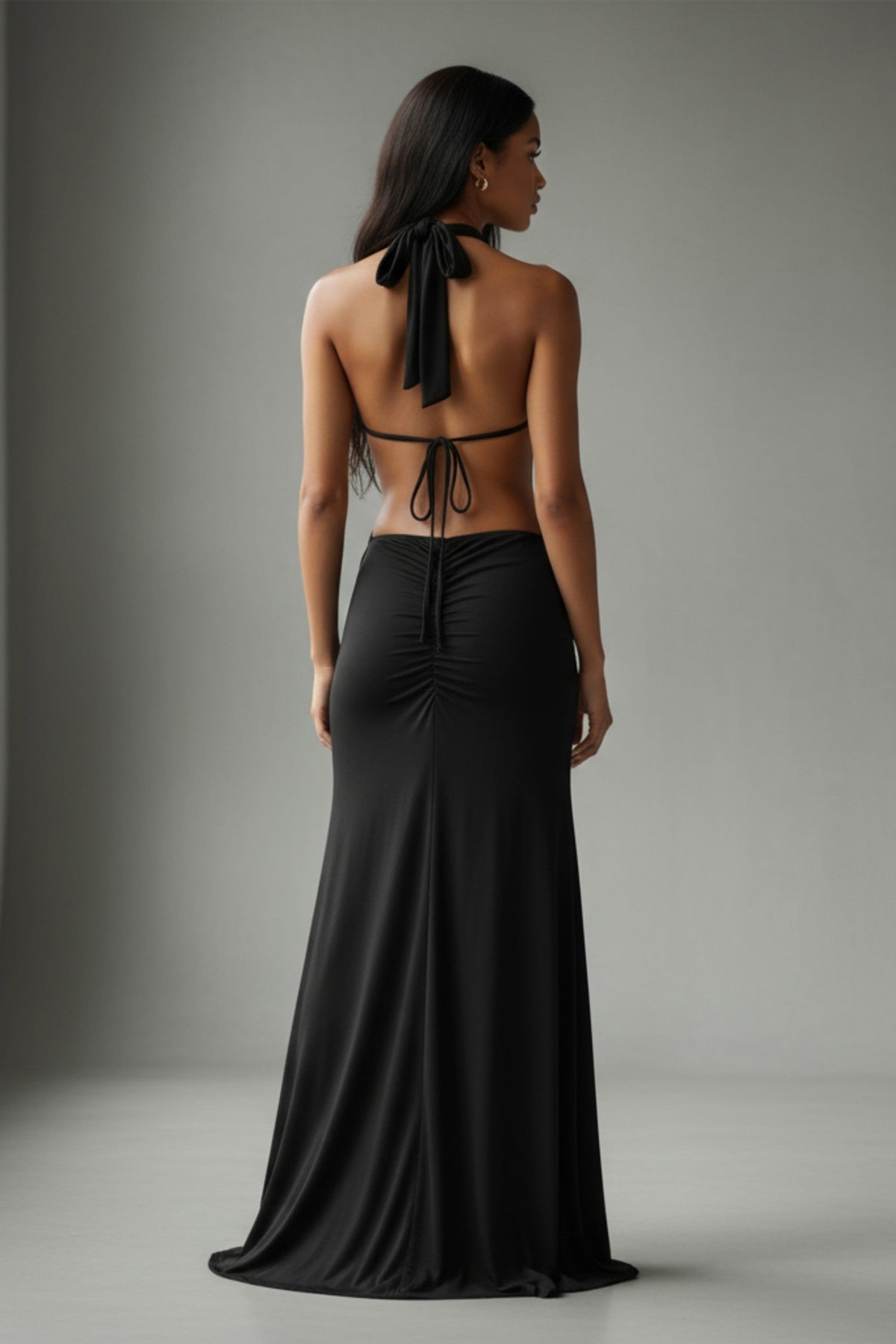 Black cutout open back halter maxi dress, alternate front view on model