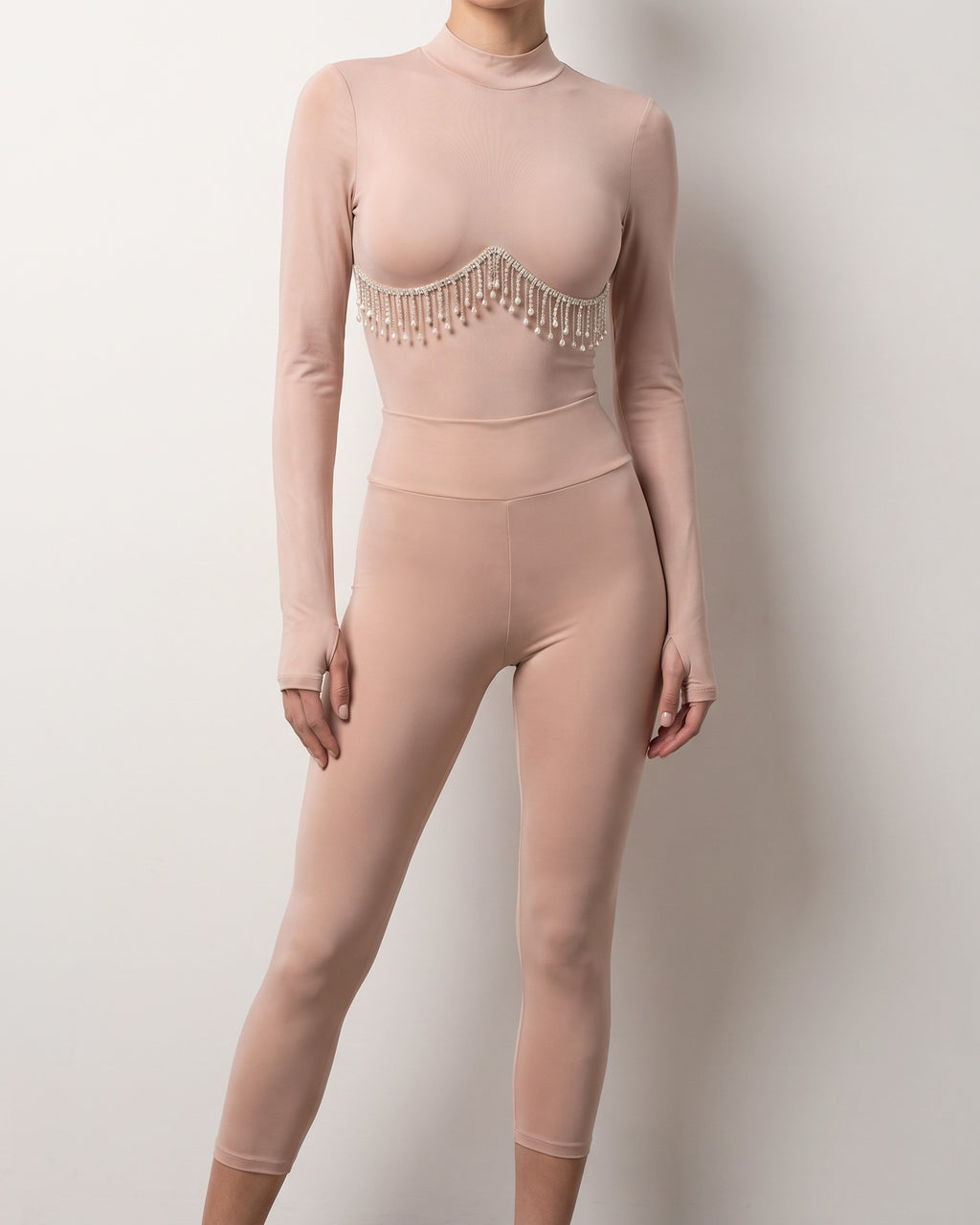 Muvin women's nude rhinestone underboob trimmed bodysuit, front view on model