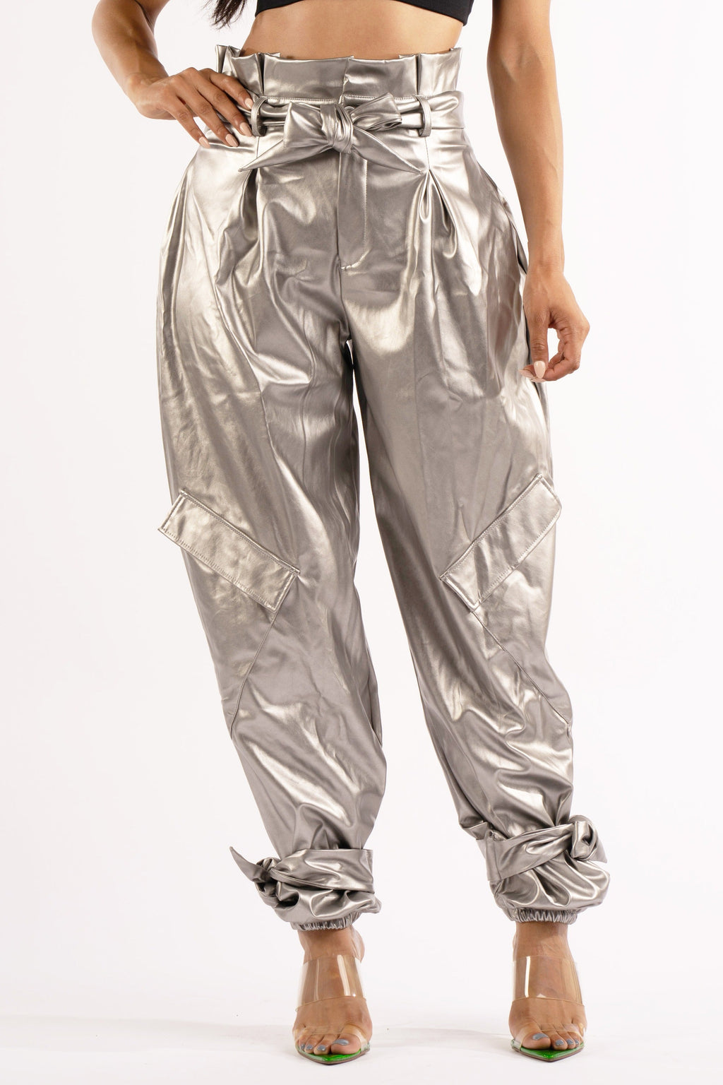 Silver metallic PU jogger pants, front view on model
