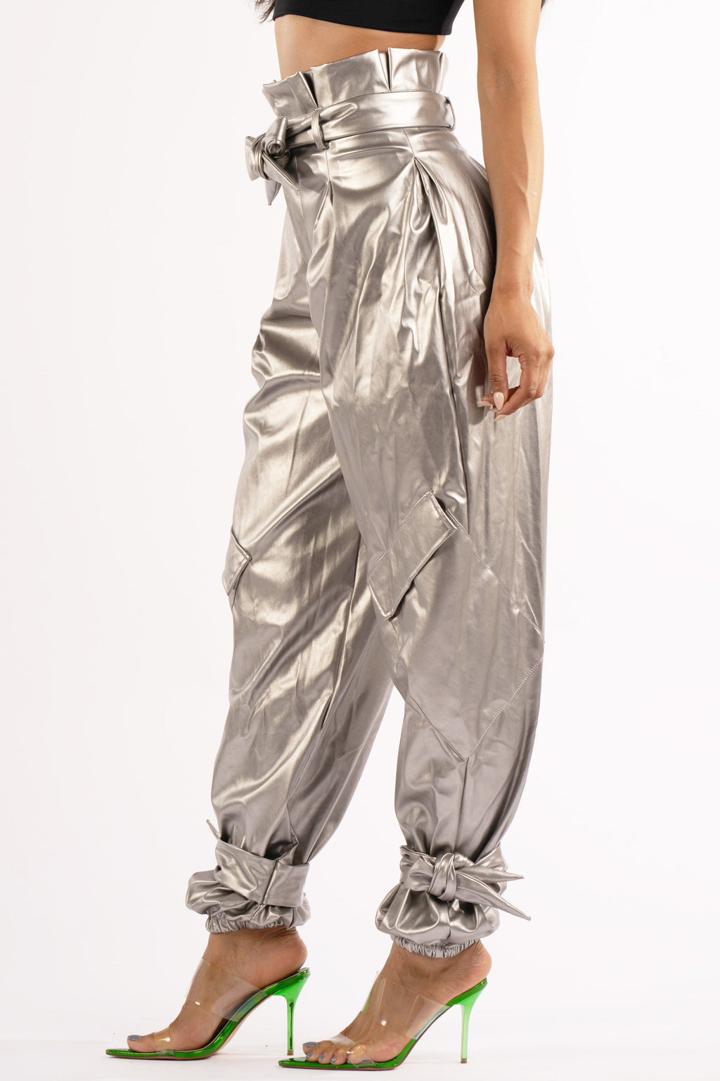 Silver metallic PU jogger pants, alternate front view on model