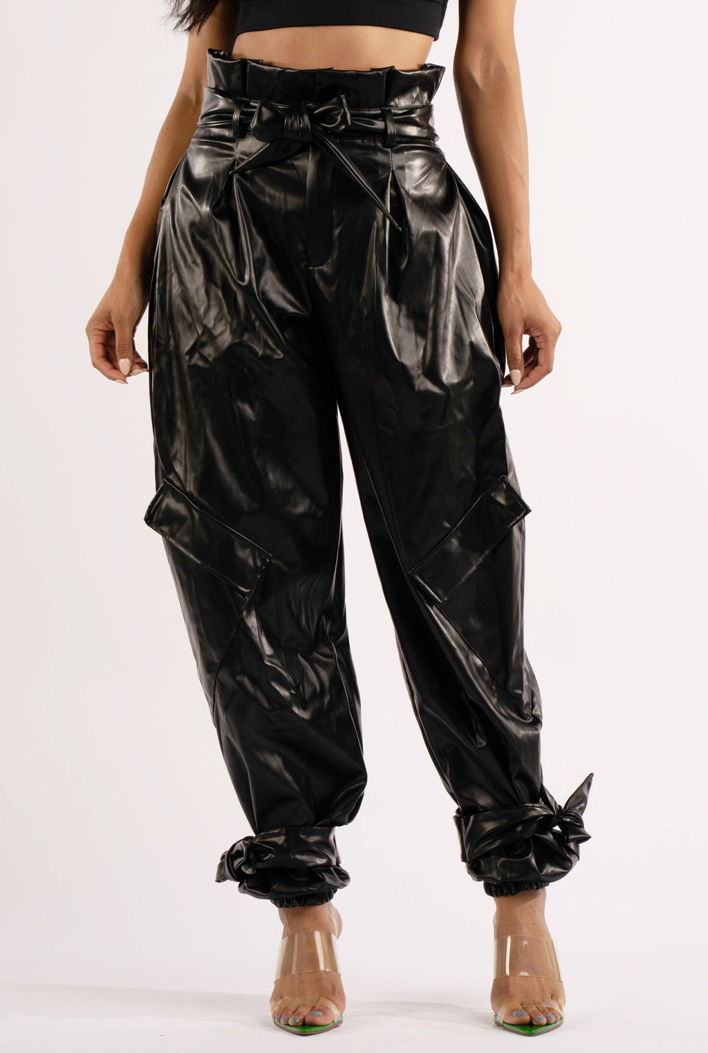 Black metallic PU jogger pants, back view on model