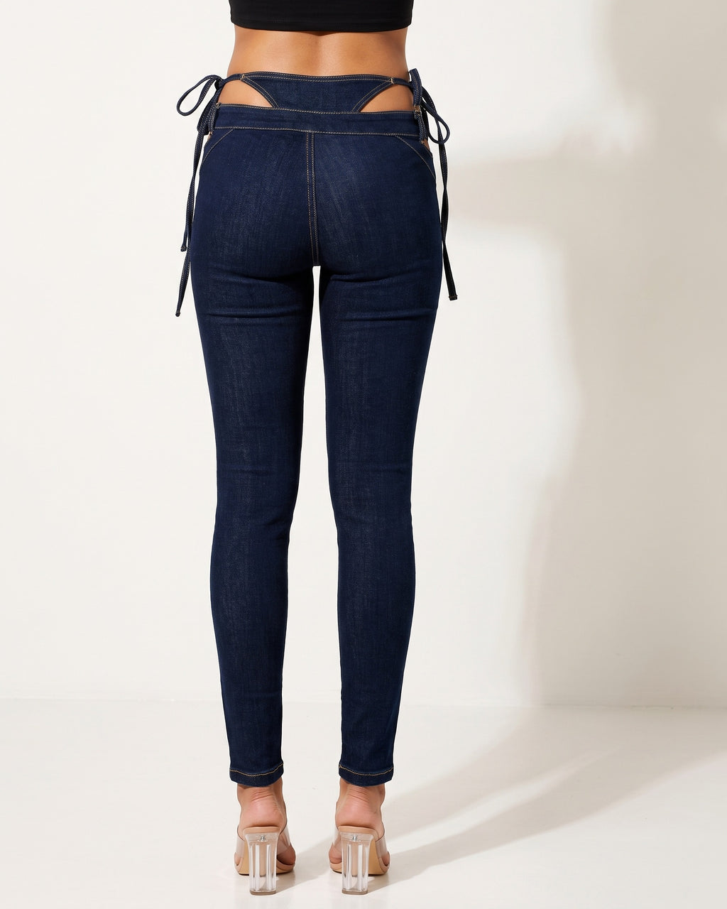 Indigo bikini cutout denim pants, back view on model