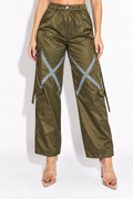 Olive windbreaker cargo pants with reflective trim, front view showing silver X-shaped thigh tape and button waistband