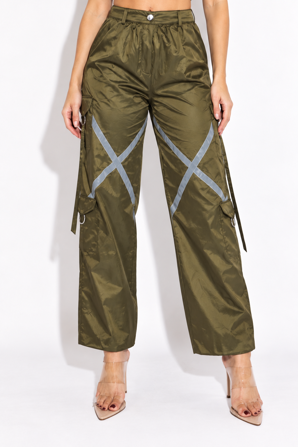 Olive windbreaker cargo pants with reflective trim, front view showing silver X-shaped thigh tape and button waistband
