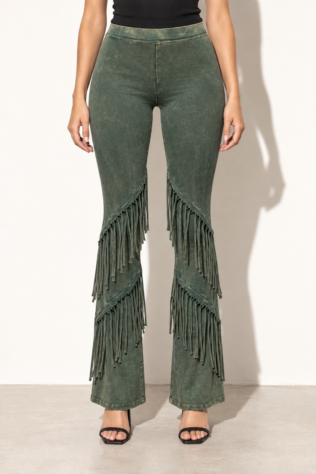 Muvin women's olive mineral washed fringe flare pants, front view with two diagonal fringe rows on each leg