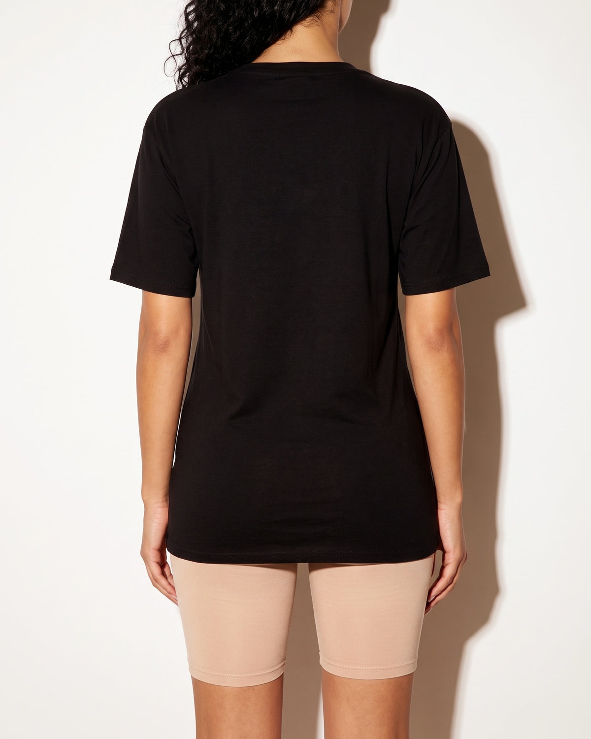Black front cutout oversize top, back view on model