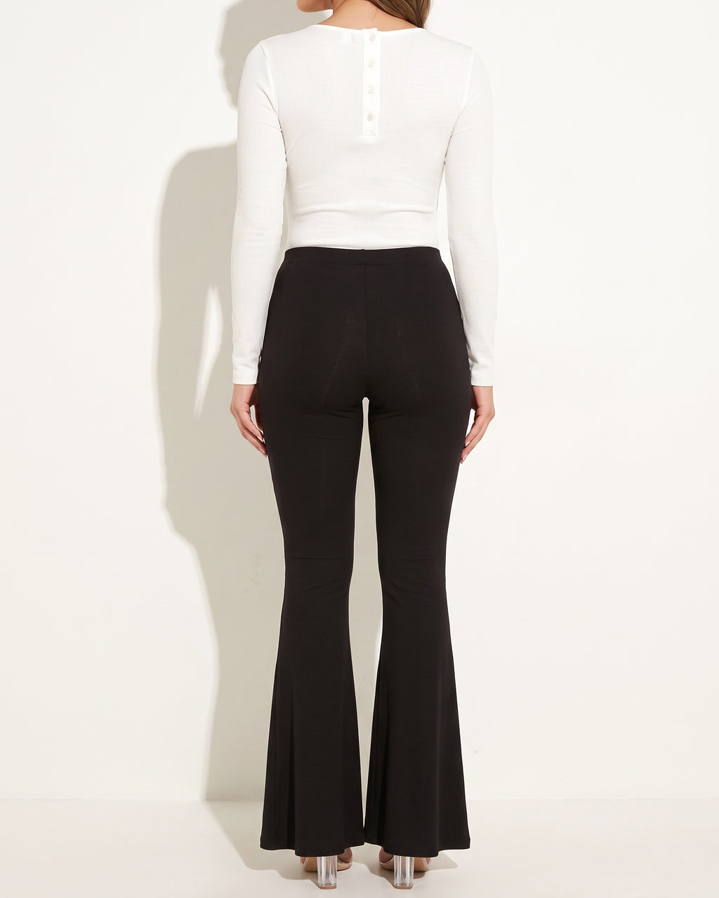 White ribbed henley deep V neck bodysuit, back view on model