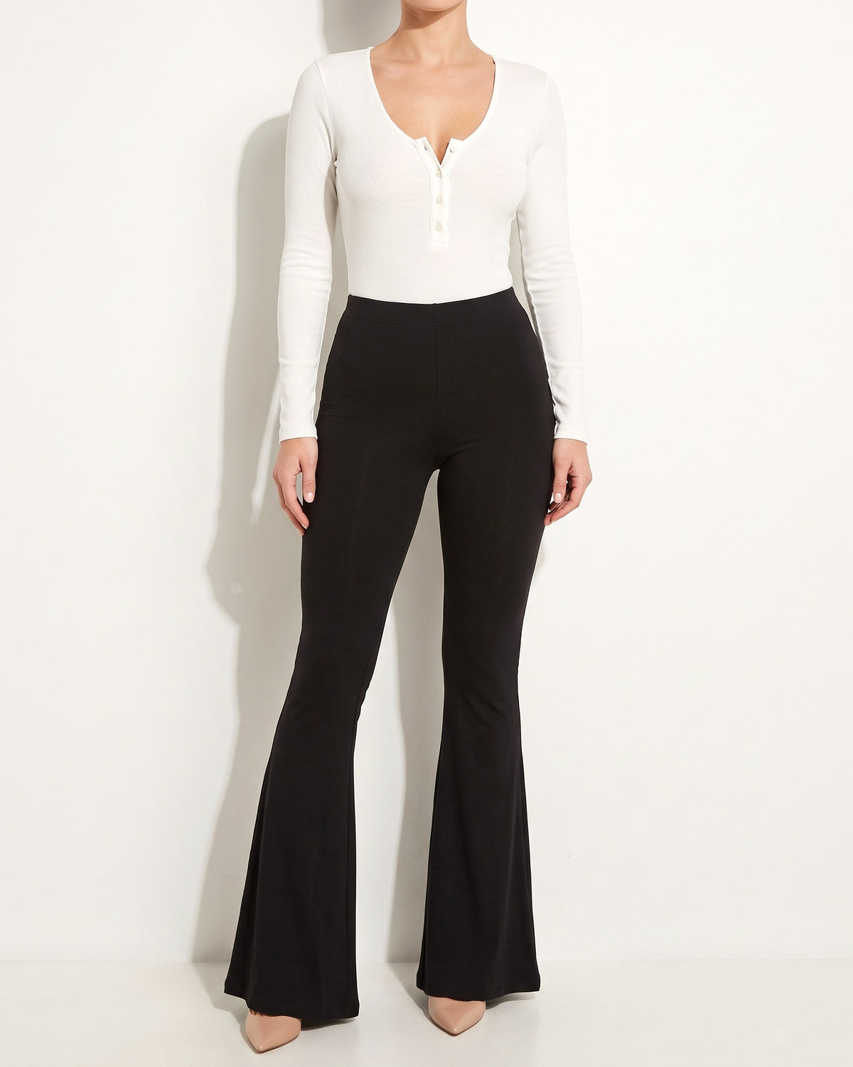 Muvin women's white ribbed henley deep V neck bodysuit, front view on model