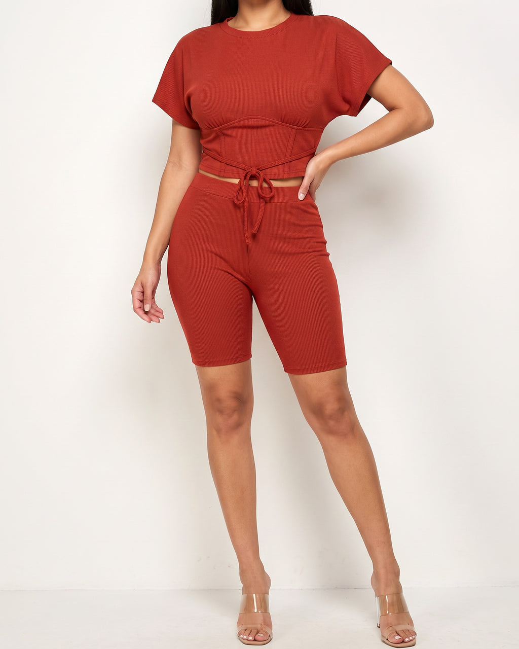 Muvin women's rust corseted top and biker set, front view on model