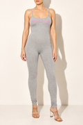 Muvin women's grey spaghetti strap jumpsuit, front view with pink chest lettering and slim ankle-length legs
