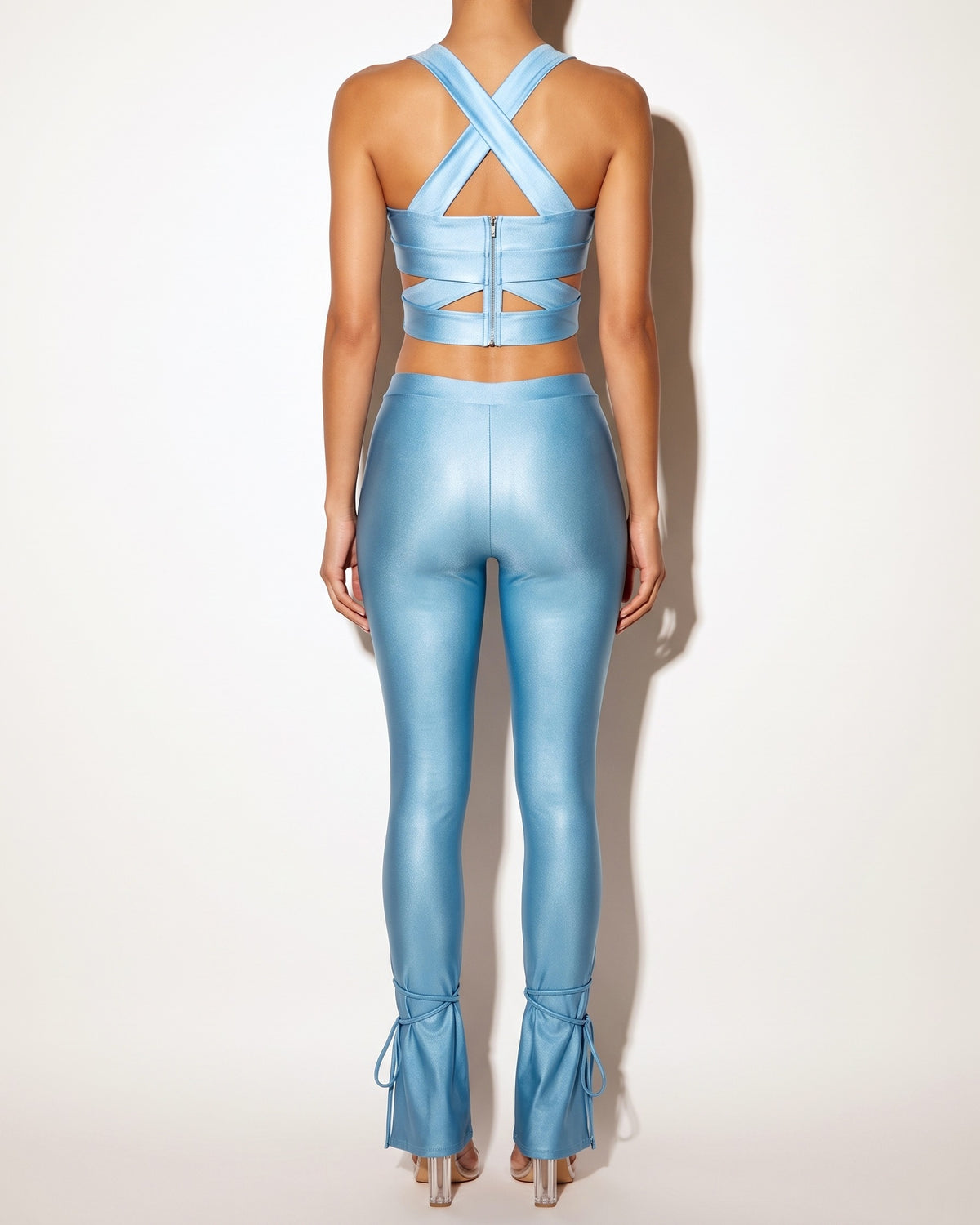 Light blue cut out top and tide bottom pants set, back view on model