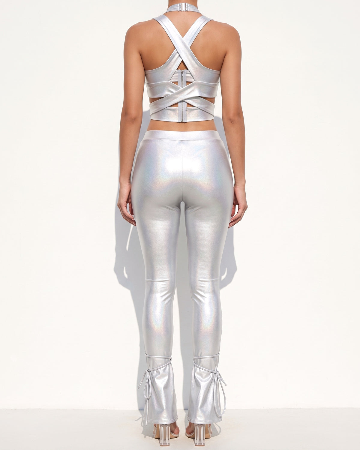 White cut out top and tide bottom pants set, back view on model
