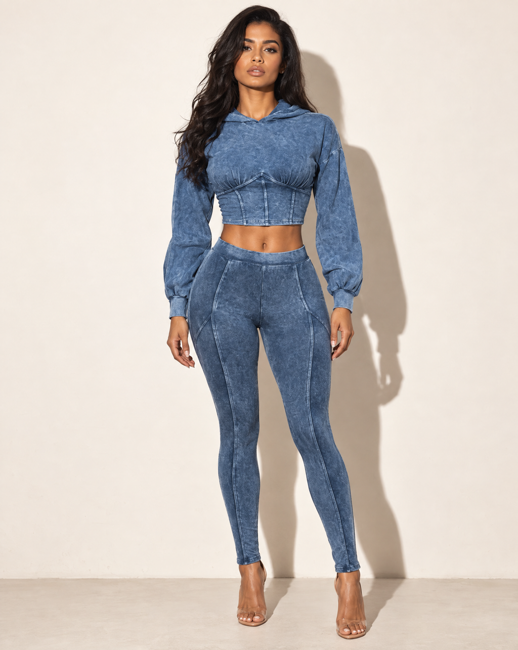 Muvin women's dark denim mineral-washed hooded top and leggings set, front view on model