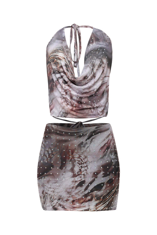 Two-piece outfit with a patterned top and skirt on a white background