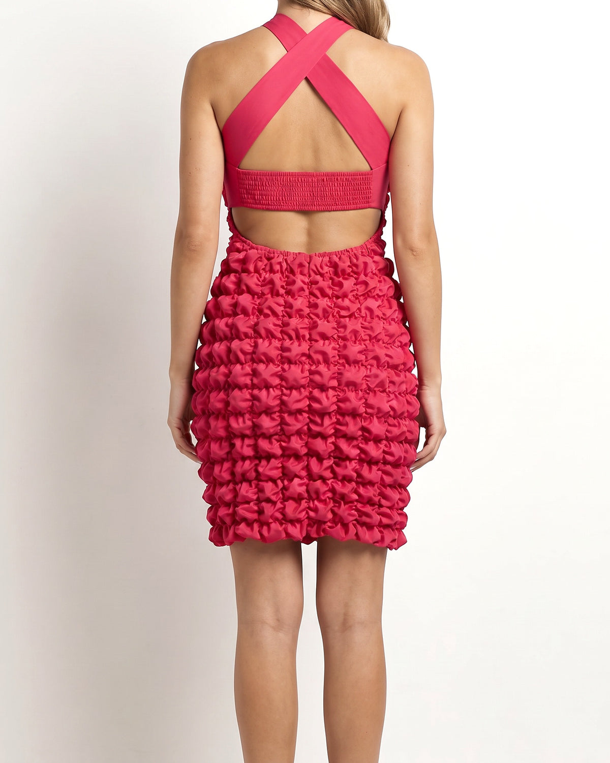 Pink crinkled skirt halter dress, back view on model