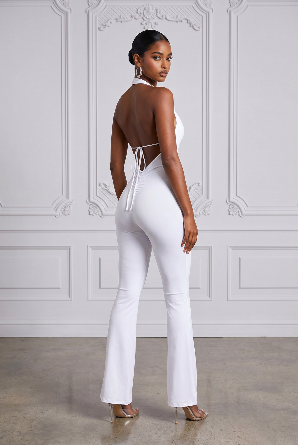White backless halter jumpsuit, styled look on model