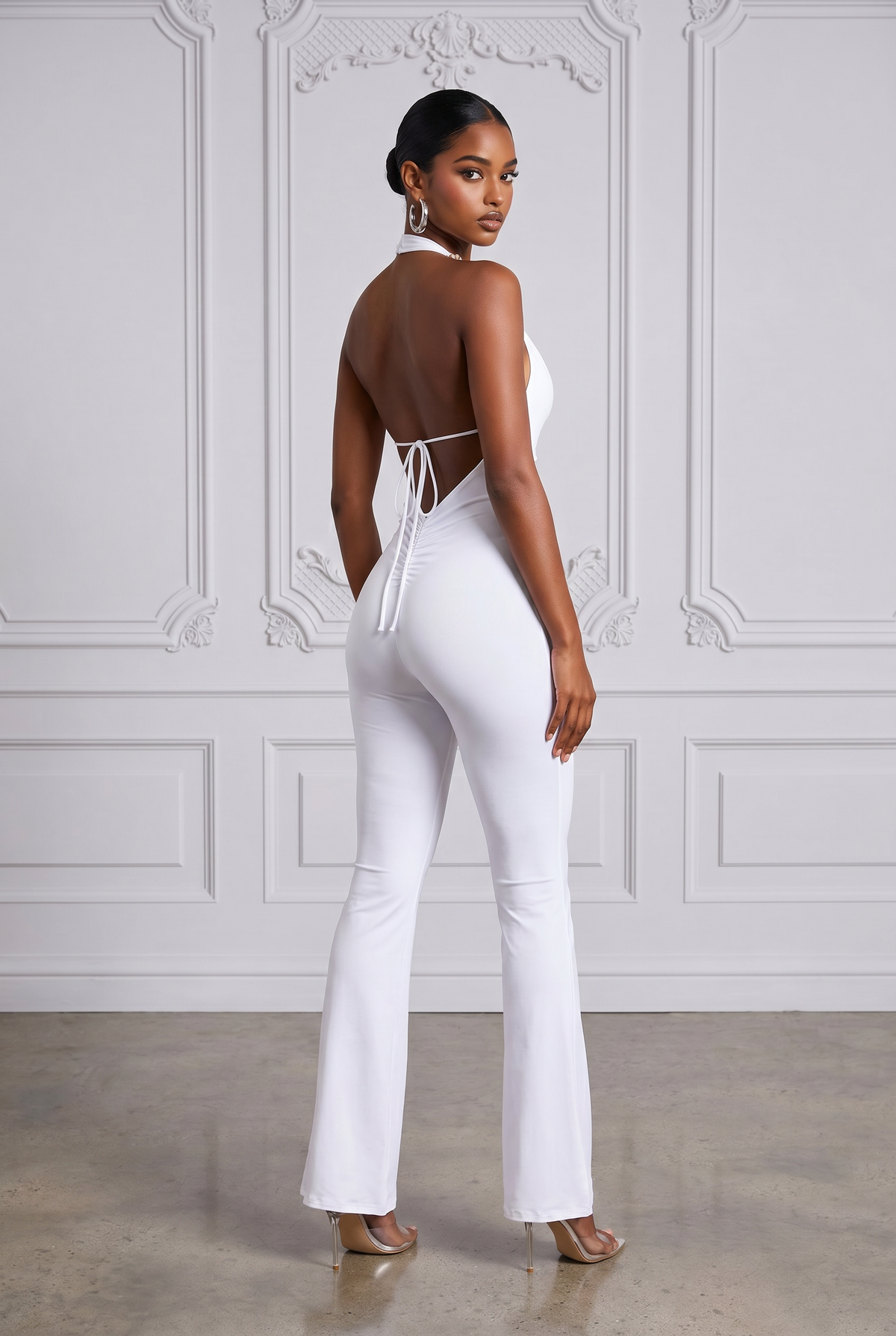 White backless halter jumpsuit, styled look on model