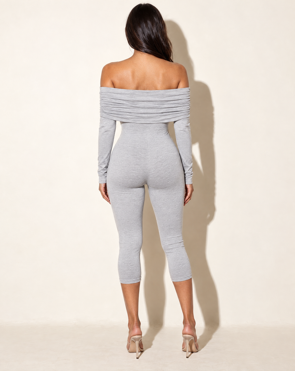 Grey off-shoulder long-sleeve capri jumpsuit, back view on model