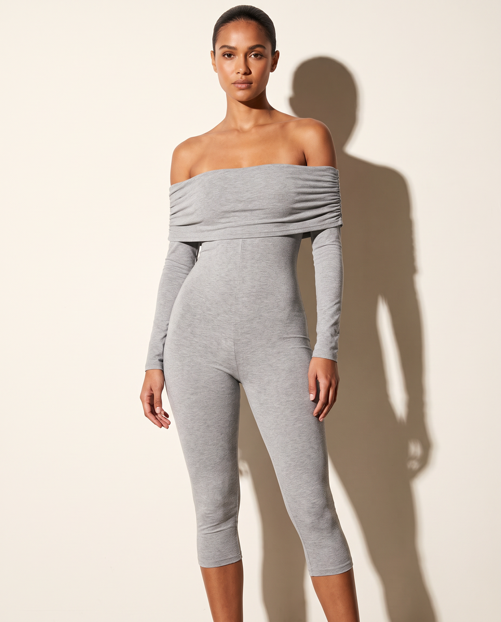 Muvin women's grey off-shoulder long-sleeve capri jumpsuit, front view on model