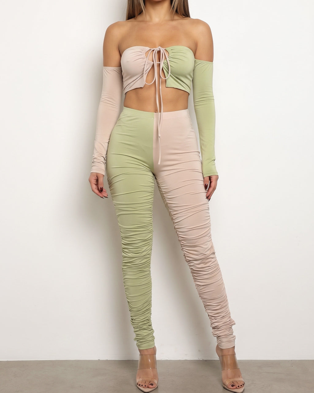 Nude and sage color blocked ruched set, front view on model