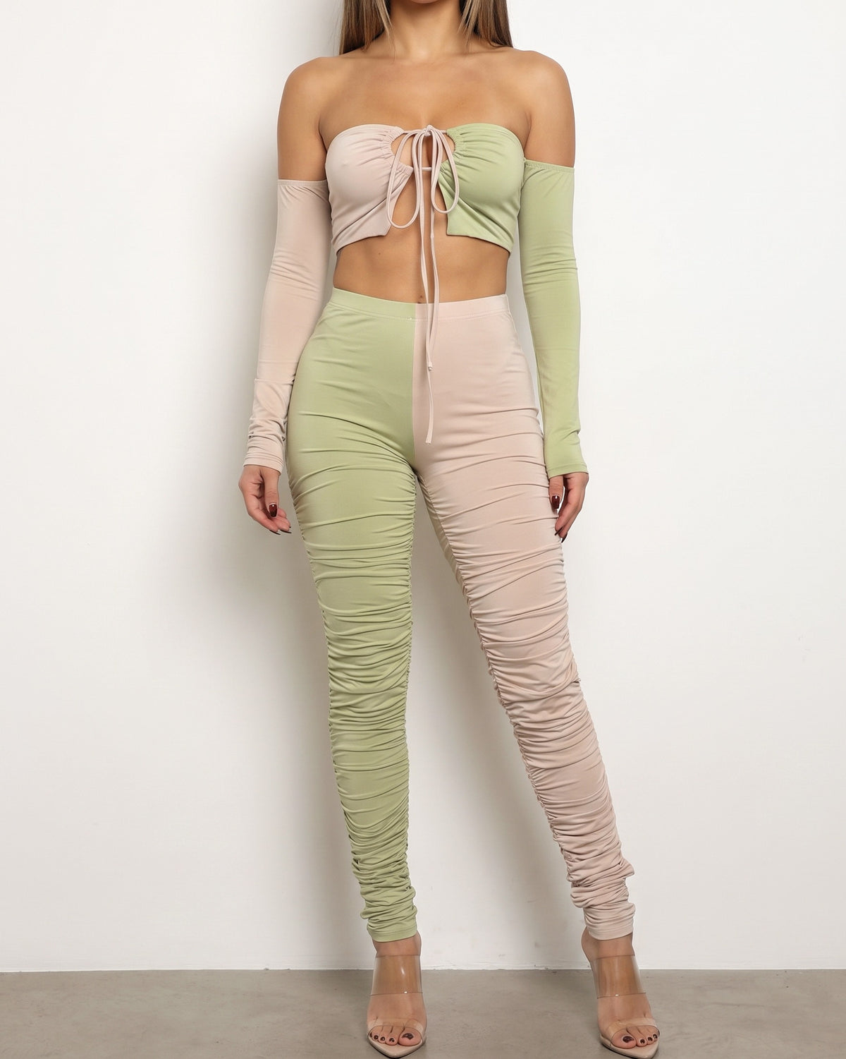 Nude and sage color blocked ruched set, front view on model