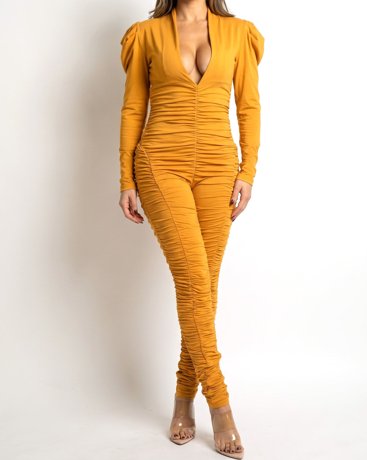 Muvin women's mustard ruched jumpsuit with power shoulder, front view on model